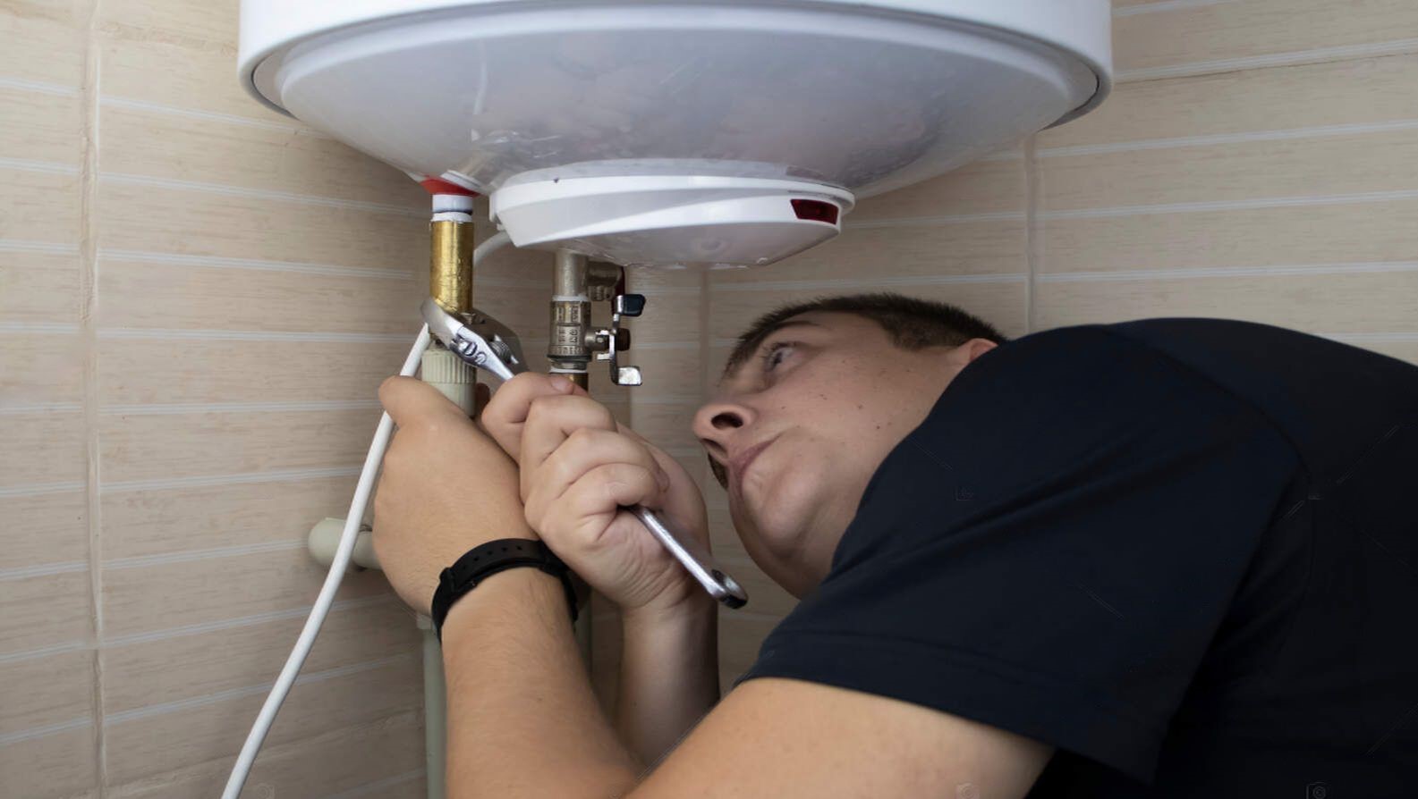 depositphotos_408547260-stock-photo-boiler-repair-technician-uses-adjustable-transformed